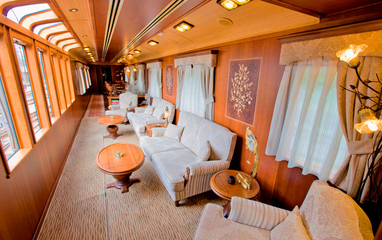 Elegant lounge car interior of El Transcantabrico luxury train with comfortable seating and panoramic windows